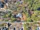 Aerial view of a unique home with a metal roof and beautiful landscaping at 723 Chelsea Dr, Sanford, NC 27332