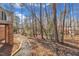 Beautiful backyard with brick foundation and stone walkway, surrounded by natural landscape at 723 Chelsea Dr, Sanford, NC 27332