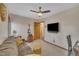 Spare bedroom features a large brown sofa, a decorative clock, and a guitar at 723 Chelsea Dr, Sanford, NC 27332