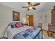 Comfortable bedroom featuring a ceiling fan, patriotic themed decorations, and natural light at 723 Chelsea Dr, Sanford, NC 27332