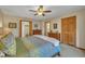 Bright bedroom with ceiling fan, two large closets and ensuite bathrooms connected to a bedroom at 723 Chelsea Dr, Sanford, NC 27332