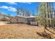 Charming home with brick driveway, American flag, screened-in porch, and wooded setting at 723 Chelsea Dr, Sanford, NC 27332
