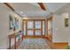 Inviting foyer with hardwood floors, area rug, and beautiful wood double doors at 723 Chelsea Dr, Sanford, NC 27332