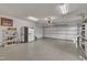 Spacious two-car garage featuring epoxy floors, ample storage space, and a clean, organized layout at 723 Chelsea Dr, Sanford, NC 27332