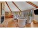 Inviting living room boasts vaulted ceilings, a brick fireplace, and many windows for bright light at 723 Chelsea Dr, Sanford, NC 27332
