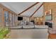 Large living room featuring a fireplace, vaulted ceilings, hardwood floors, and generous natural light at 723 Chelsea Dr, Sanford, NC 27332