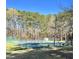 Tennis courts surrounded by trees at 723 Chelsea Dr, Sanford, NC 27332