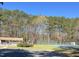 View of community tennis courts and parking area at 723 Chelsea Dr, Sanford, NC 27332