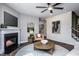 Comfortable living room featuring a fireplace, artwork, and stylish furnishings for a relaxing ambiance at 724 Denburn Pl, Raleigh, NC 27603