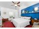Serene bedroom featuring hardwood floors, a ceiling fan, and stylish modern accents at 7525 Poplar Meadow Ln, Raleigh, NC 27616
