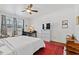 Comfortable bedroom with natural light, ceiling fan, and neutral decor at 7525 Poplar Meadow Ln, Raleigh, NC 27616