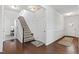 Grand entryway with hardwood floors, staircase, and neutral-colored walls and carpet at 7525 Poplar Meadow Ln, Raleigh, NC 27616