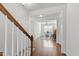 Bright foyer with hardwood floors, white trim, and an open view to the living area at 7525 Poplar Meadow Ln, Raleigh, NC 27616