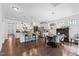 Modern kitchen with stainless steel appliances, large island with seating, and open to the dining area at 7525 Poplar Meadow Ln, Raleigh, NC 27616