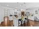 Bright kitchen with stainless steel appliances, large island with seating, and ample cabinet space at 7525 Poplar Meadow Ln, Raleigh, NC 27616