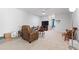 Cozy living room features neutral carpet, ceiling fan, and ample natural light at 7525 Poplar Meadow Ln, Raleigh, NC 27616