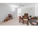 Bright living room with neutral carpet and a cozy ceiling fan overhead at 7525 Poplar Meadow Ln, Raleigh, NC 27616