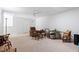 Spacious carpeted living room offering a ceiling fan and lots of open space at 7525 Poplar Meadow Ln, Raleigh, NC 27616