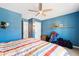 Bedroom with an inviting bed and a ceiling fan, creating a relaxing atmosphere at 7525 Poplar Meadow Ln, Raleigh, NC 27616