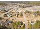 Wide aerial view of a neighborhood featuring single-Gathering homes and tree-lined streets at 7800 Twin Pines Way, Fuquay Varina, NC 27526