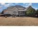 Backyard view of the home with a grill, patio, and a screened-in porch at 7800 Twin Pines Way, Fuquay Varina, NC 27526