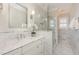 Elegant bathroom showcasing marble countertops, a glass shower, and stylish fixtures at 7800 Twin Pines Way, Fuquay Varina, NC 27526