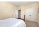 Bedroom with neutral paint, carpet, ceiling fan, and spacious closet at 7800 Twin Pines Way, Fuquay Varina, NC 27526