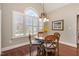 Cozy dining area with natural light and traditional wooden furnishings at 7800 Twin Pines Way, Fuquay Varina, NC 27526