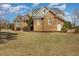 Beautiful brick home with well-maintained landscaping and a side-entry garage at 7800 Twin Pines Way, Fuquay Varina, NC 27526