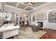 Elegant living room featuring a fireplace, built-ins, coffered ceiling, and hardwood floors at 7800 Twin Pines Way, Fuquay Varina, NC 27526