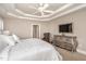 Comfortable main bedroom featuring a ceiling fan and ample natural light at 7800 Twin Pines Way, Fuquay Varina, NC 27526