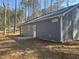Exterior view of a new home featuring light blue siding, white trim, and a small backyard at 810 Jasmine Rd, Fuquay Varina, NC 27526