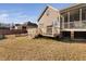 Exterior view of back deck and yard, perfect for outdoor entertaining at 82 Wood Valley Dr, Four Oaks, NC 27524