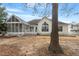 Exterior of the house with a screened porch and a large window at 8513 Barrett Hall Ln, Wake Forest, NC 27587