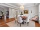 Elegant dining room features a chandelier, hardwood floors, and neutral décor for a timeless appeal at 8513 Barrett Hall Ln, Wake Forest, NC 27587