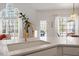 Bright kitchen featuring a white countertop, gold faucet, and a large arched window letting in natural light at 8513 Barrett Hall Ln, Wake Forest, NC 27587