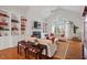 Bright and airy living room with hardwood floors, built-in shelves, fireplace, and a large window at 8513 Barrett Hall Ln, Wake Forest, NC 27587