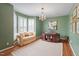 Inviting office space with hardwood floors, natural light, and cozy seating for working from home at 8513 Barrett Hall Ln, Wake Forest, NC 27587