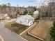 Aerial view of the home showcasing the well-manicured lawn, landscape design, and quiet neighborhood at 100 W Acres Cres, Cary, NC 27519