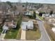 Aerial view of the home showcasing the well-manicured lawn, landscape design, and quiet neighborhood at 100 W Acres Cres, Cary, NC 27519