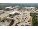 Commercial building featuring ample parking and landscaped surroundings, near shops and main roads at 100 W Acres Cres, Cary, NC 27519