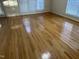 Spacious bedroom featuring hardwood floors and natural light from large windows at 100 W Acres Cres, Cary, NC 27519