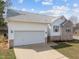 A lovely home with a two-car garage, brick accents, and a driveway at 100 W Acres Cres, Cary, NC 27519