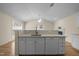 Modern kitchen island with bar top provides extra seating and prep space, complemented by updated appliances at 100 W Acres Cres, Cary, NC 27519