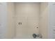 A bright laundry room with tile floor, white walls, and a wire shelf for storage at 100 W Acres Cres, Cary, NC 27519