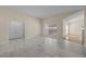 Inviting living room with large windows and modern marble-look flooring at 100 W Acres Cres, Cary, NC 27519