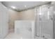 A main bathroom with a large tub, glass shower, and access to toilet and closet at 100 W Acres Cres, Cary, NC 27519