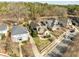This bird's-eye showcases a home with lush landscaping in a neighborhood with mature trees and well-kept homes at 10040 Ward, Chapel Hill, NC 27517