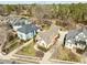 A high angle shows the property with manicured landscaping in a well-maintained neighborhood with mature trees at 10040 Ward, Chapel Hill, NC 27517