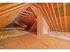 Exposed attic space with wooden beams and insulation at 10040 Ward, Chapel Hill, NC 27517